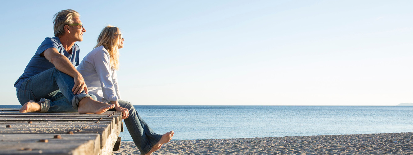 Couple sitting on dock